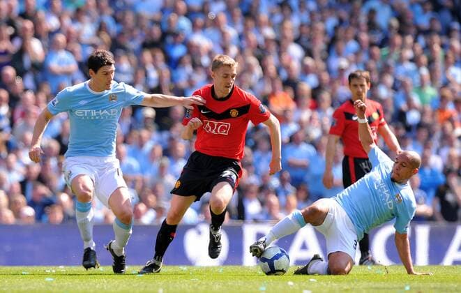 Nigel De Jong (R) and Gareth Barry (L) of Manchester City intercepts a pass from Darren Fletcher (C) of Manchester United Barclays Premier League - Manchester City vs. Manchester United (ManU) 17th April, 2010 EDITORIAL USE ONLY. No use with unauthorised audio, video, data, fixture lists, club league logos or live services. Online in-match use limited to 120 images, no video emulation. No use in betting, games or single club league player publications.