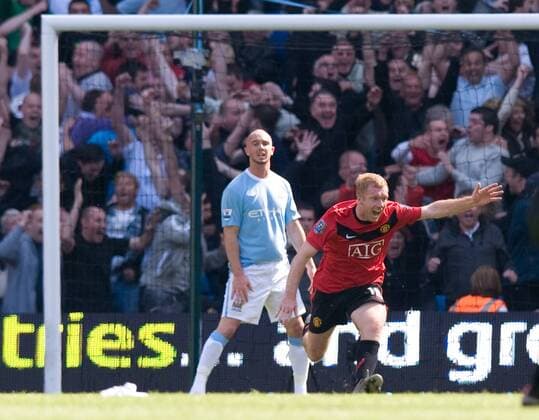 Paul Scholes (R) of Manchester United turns to celebrate scoring the winning goal Barclays Premier League - Manchester City vs. Manchester United (ManU) 17th April, 2010 EDITORIAL USE ONLY. No use with unauthorised audio, video, data, fixture lists, club league logos or live services. Online in-match use limited to 120 images, no video emulation. No use in betting, games or single club league player publications.
