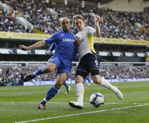 Tottenham s Roman Pavlyuchenko tussles with Chelsea s Alex - Barclays Premier League --- Tottenham Hotspur (white) v FC Chelsea (blue) --- 17th April, 2010 EDITORIAL USE ONLY. No use with unauthorised audio, video, data, fixture lists, club league logos or live services. Online in-match use limited to 120 images, no video emulation. No use in betting, games or single club league player publications.