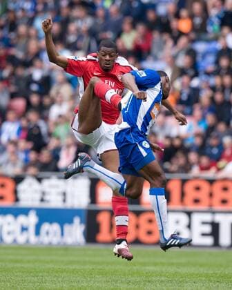 Vassiriki Diaby of Arsenal FC London (L) raises a boot in a challenge with Maynor Figueroa of Wigan Athletic Barclays Premier League Wigan Athletic v Arsenal 18th April, 2010 EDITORIAL USE ONLY. No use with unauthorised audio, video, data, fixture lists, club league logos or live services. Online in-match use limited to 120 images, no video emulation. No use in betting, games or single club league player publications.