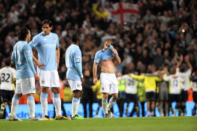 Manchester City s Pablo Zabaleta looks on dejected as Tottenham s players celebrate Barclays Premier League Manchester City (blue) v Tottenham Hotspur (white) 5th May, 2010 EDITORIAL USE ONLY. No use with unauthorised audio, video, data, fixture lists, club league logos or live services. Online in-match use limited to 120 images, no video emulation. No use in betting, games or single club league player publications.
