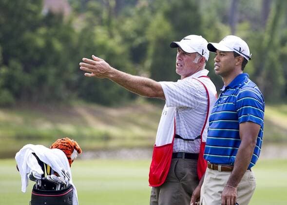Tiger Woods (USA, R) talks with his caddie Steve Williams during the first round of The Players Championship PGA golf tournament in Ponte Vedra Beach -  PVB2010050611