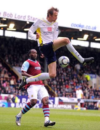 Peter Crouch of Tottenham gets above Andre Bikey of Burnley , FC Burnley (red) - Tottenham Hotspur (white) EDITORIAL USE ONLY. No use with unauthorised audio, video, data, fixture lists, club league logos or live services. Online in-match use limited to 120 images, no video emulation. No use in betting, games or single club league player publications.