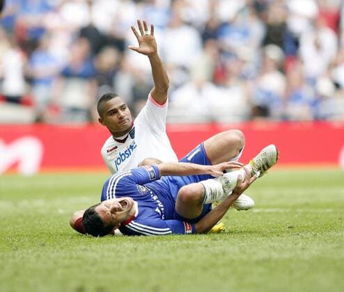 Chelsea s Michael Ballack (R) gets injured by Portsmouth s Kevin Prince Boateng EON FA Cup Final Chelsea FC v Portsmouth FC 15th May, 2010 EDITORIAL USE ONLY. No use with unauthorised audio, video, data, fixture lists, club league logos or live services. Online in-match use limited to 120 images, no video emulation. No use in betting, games or single club league player publications.