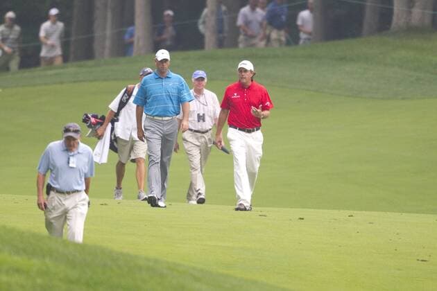 05 JUN 2010: Stewart Cink (USA, blue) and Phil Mickelson (USA) walk toward the clubhouse after play was suspended during the 3rd round of the Memorial Tournament held at Muirfield Village G.C. in Dublin, Ohio. Icon43910060573553 EDITORIAL USE ONLY
