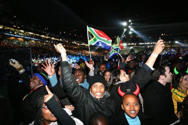 SOWETO, ? 10 June 2010: Thousands of excited soccer and music lovers attend the kick-off celebration concert at Orlando Stadium in Soweto, on 10 June 2010. Gallo117114 o0 Fan, Publikum totale