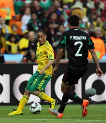 Steven Pienaar (L) of South Africa vies with Francisco Rodriguez of Mexico during a group A match of the 2010 FIFA World Cup at Soccer City stadium in Soweto, suburban Johannesburg of South Africa on June 11, 2010. 