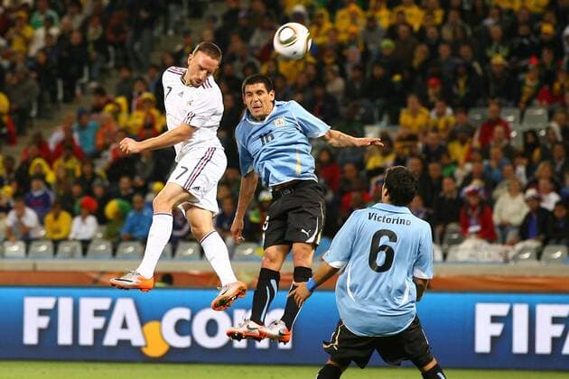Uruguay (blue) vs France - Franck Ribery (FRA) vs Maximiliano Pereira (Uruguay) - - - 11-06-10 EddyLEMAISTRE  Sponsor, Werbepartner, Werbung, Wirtschaft Werbebande, Bande, Werbung FIFA FIFA.com