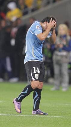 Nicolas Lodeiro of Uruguay leaves the pitch after being given the red card during a Group match of the 2010 FIFA World Cup between Uruguay and France in Cape Town, on June 11, 2010. The match ended with a 0-0 draw. - France (white) vs Uruguay - 