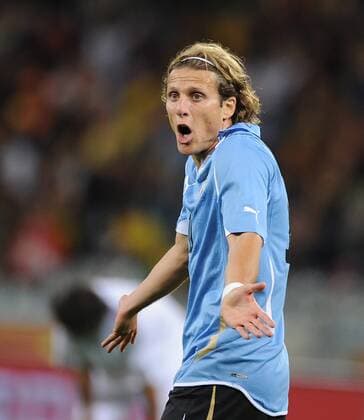 Uruguay s Diego Forlan reacts during a Group match of the 2010 FIFA World Cup with France in Cape Town, on June 11, 2010. The match ended with a 0-0 draw. - France (white) vs Uruguay - 
