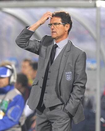Fabio Capello coach of England ponders his next move, FIFA World Cup 2010 Group C, England - USA 12th June, 2010 - EDITORIAL USE ONLY. No use with unauthorised audio, video, data, fixture lists, club league logos or live services. Online in-match use limited to 120 images, no video emulation. No use in betting, games or single club league player publications. o0 Nationaltrainer, Trainer