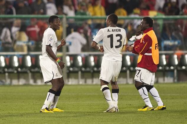 Asamoah Gyan (L), Andre Ayew (C) and Rahim Ayew (GHA) celebrate - FIFA World Cup 2010 Group D match between Serbia 0-1 Ghana at Loftus Versfeld Stadium in Pretoria..  (011672)