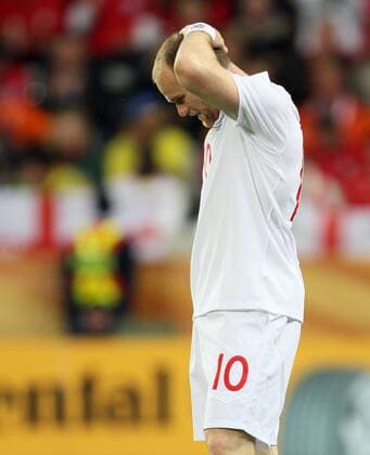 England s Wayne Rooney looks on dejected FIFA World Cup 2010 Group C England v Algeria 18th June, 2010 EDITORIAL USE ONLY. No use with unauthorised audio, video, data, fixture lists, club league logos or live services. Online in-match use limited to 120 images, no video emulation. No use in betting, games or single club league player publications. o0 Cape Town