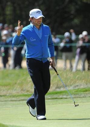 Graeme McDowell of Northern Ireland responds to the cheers after scoring a birdie on the second hole on the day three of the U.S. Open in Pebble Beach, California on June 19, 2010.  PBP2010061907