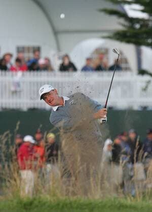 Ernie Els of South Africa blasts out of a bunker to the 18th green on the day three of the U.S. Open in Pebble Beach, California on June 19, 2010.  PBP2010061928