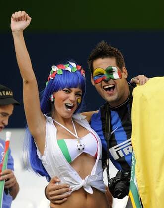 A Bikini clad Italian fan with her friend FIFA World Cup 2010 Group F 20th June, 2010 EDITORIAL USE ONLY. No use with unauthorised audio, video, data, fixture lists, club league logos or live services. Online in-match use limited to 120 images, no video emulation. No use in betting, games or single club league player publications. o0 Fan, Publikum, Gesichtsbemalung, Bemalung, bemalt, Nationalfarben, Landesfarben,