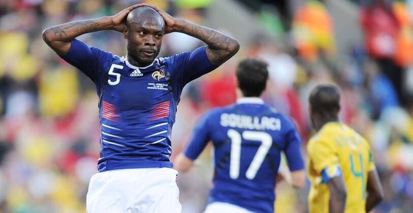 France s William Gallas (L) reacts during a Group A match between France and South Africa at the 2010 World Cup football match in Bloemfontein - 