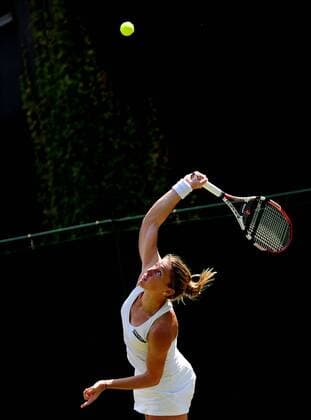 Pauline Parmentier of France serves during the women s singles first round match at the 2010 Wimbledon tennis championships in London - 