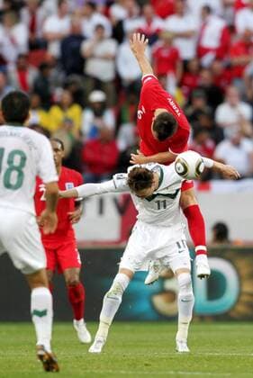 (100623) -- PORT ELIZABETH, June 23, 2010 () -- England s John Terry (Top) vies with Slovenia s Milivoje Novakovic during the 2010 World Cup Group C soccer match at Nelson Mandela Bay stadium in Port Elizabeth, June 23, 2010. - 