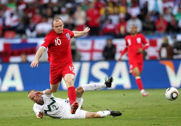 (100623) -- PORT ELIZABETH, June 23, 2010 () -- England s Wayne Rooney (Top) vies with Slovenia s Miso Brecko during the 2010 World Cup Group C soccer match at Nelson Mandela Bay stadium in Port Elizabeth, June 23, 2010. - 