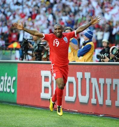 Football - 2010 FIFA World Cup - Slovenia vs. England, England s Jermain Defoe celebrates scoring their opening goal at the Nelson Mandela Bay Stadium, Port Elizabeth 