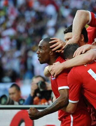 England s Jermain Defoe (L) celebrates scoring their opening goal at the Nelson Mandela Bay Stadium, Port Elizabeth 