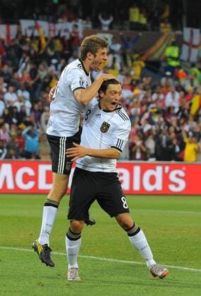 Thomas Mueller of Germany (L) celebrates scoring their fourth goal with Mesut Oezil of Germany FIFA World Cup 2010 Round of 16 Germany v England 27th June, 2010 EDITORIAL USE ONLY. No use with unauthorised audio, video, data, fixture lists, club league logos or live services. Online in-match use limited to 120 images, no video emulation. No use in betting, games or single club league player publications. o0 Freude Emotionen