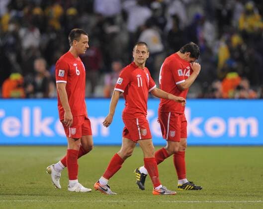 Dejected England players leave the field from left: John Terry, Joe Cole, Gareth Barry - FIFA World Cup 2010 Round of 16 Germany v England (red) - 27th June, 2010 - EDITORIAL USE ONLY. No use with unauthorised audio, video, data, fixture lists, club league logos or live services. Online in-match use limited to 120 images, no video emulation. No use in betting, games or single club league player publications.