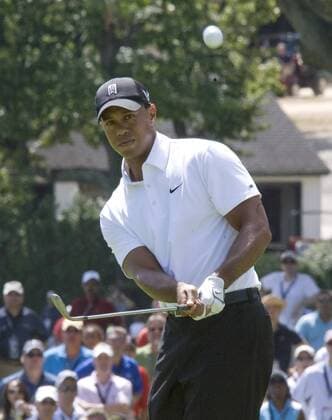 Tiger Woods watches his chip shot on hole 9 during first round play of the AT&T National at Aronimink Golf Club in Newtown Square, Pennsylvania on July 1, 2010. Woods finished the day with a 3 over par 73.  PHI2010070102