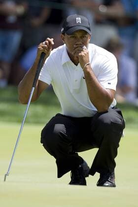 Tiger Woods (USA) studying the greens during the first round of the AT&T National at Aronimink Golf Club in Newtown Square, Pennsylvania. Icon1007010171 EDITORIAL USE ONLY