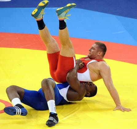 Russia s Khasan Baroev (red) wrestles Cuba s Mijain Lopez in the men s 120kg Greco-Roman final at the Beijing 2008 Olympic Games -  640588