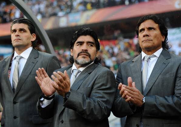 Football - 2010 FIFA World Cup - QuarterFinal - Argentina vs. Germany - Diego Maradona (C) head coach of Argentina with his assistants Alejandro Mancuso (L) and Hector Enrique at Green Point Stadium, Cape Town 