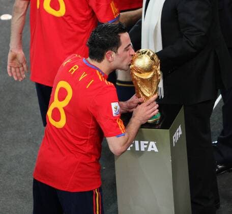 Spain s Xavi Hernandez kisses the trophy - EDITORIAL USE ONLY. No use with unauthorised audio, video, data, fixture lists, club league logos or live services. Online in-match use limited to 120 images, no video emulation. No use in betting, games or single club league player publications.