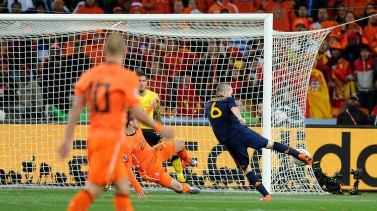 Andres Iniesta of Spain (R) scores a goal during the 2010 FIFA World Cup Final soccer match between Netherlands and Spain at Soccer City Stadium on July 11, 2010 in Johannesburg - - ZUMAgh1