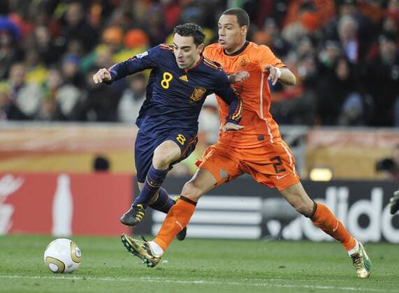 Football - World Cup Finals 2010 Spain v Netherlands ( orange ) 11 07 2010 Final: Xavi Hernandez (Spain) Gregory Van der Wiel (Holland) 