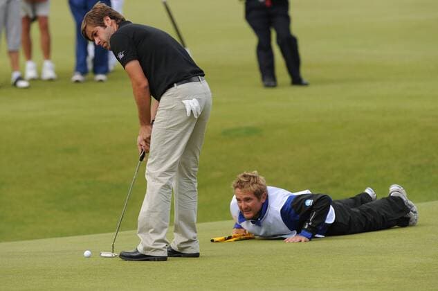 Robert Rock (England) putts on the 18th green on the third day of the Open championship in St.Andrews, Scotland on July 17, 2010.  LON2010071703