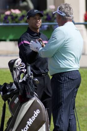ST ANDREWS SCOTLAND. 17-07-2010. Tiger WOODS (L) from the USA and Darren CLARKE from Northern Ireland in action during the third round of The Open Championship (also known as The British Open) played on The Royal and Ancient Old Course. xMitchellxGunnx  ActionPlus11071306 Content restricted for UK based newspaper