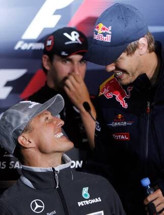 HOCKENHEIM,DEUTSCHLAND,22.JUL.10 - Formel 1 Grand Prix, GP von Deutschland, Vorberichte, Pressekonferenz. Bild zeigt Michael Schumacher (GER Mercedes GP, L) und Sebastian Vettel (GER Red Bull Racing, R), hi. Timo Glock (Virgin Racing) - 