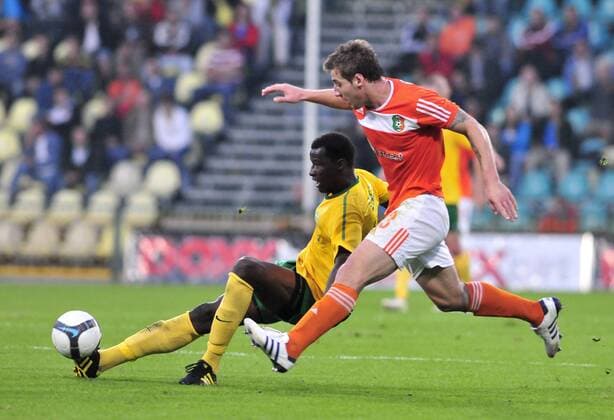 Momodou Ceesay from MSK Zilina, left, challenges for the ball with Nikolay Bodurov from Litex Lovech, right, during third qualifying round match of the Champions League in Zilina, Slovakia on Aug. 4, 2010. (CTKxPhoto JaroslavxPodhorsky)  CTKPhoto1201008040969101