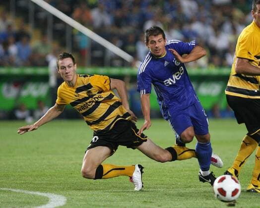 UEFA champions league qualifying match between Fenerbahce Istanbul and BSC Young Boys Bern at Sukru Saracoglu Stadium in Istanbul - Young Boys won scored 0 :1 - Francois Affolter (L) of Young Boys and Emre Belozoglu (R) of Fenerbahce. 