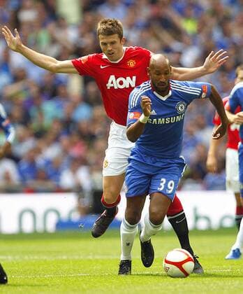 Nicolas Anelka of Chelsea (R) holds off Michael Carrick of Manchester United Community Shield - FC Chelsea v Manchester United (red) , 8th August, 2010 - EDITORIAL USE ONLY. No use with unauthorised audio, video, data, fixture lists, club league logos or live services. Online in-match use limited to 120 images, no video emulation. No use in betting, games or single club league player publications. o0 ManU