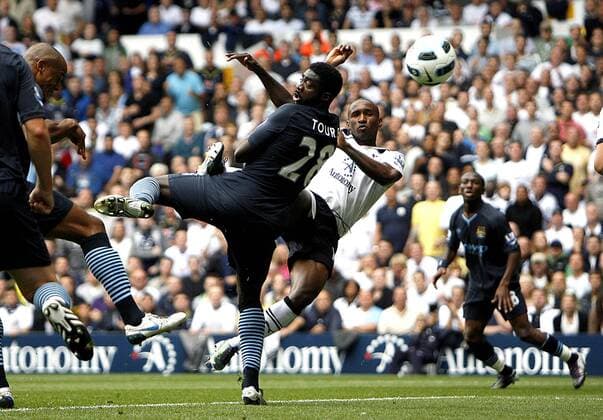 Jermain Defoe (R) of Tottenham Hotspur shoots at goal Barclays Premier League Tottenham Hotspur v Manchester City 14th August, 2010 EDITORIAL USE ONLY. No use with unauthorised audio, video, data, fixture lists, club league logos or live services. Online in-match use limited to 120 images, no video emulation. No use in betting, games or single club league player publications.