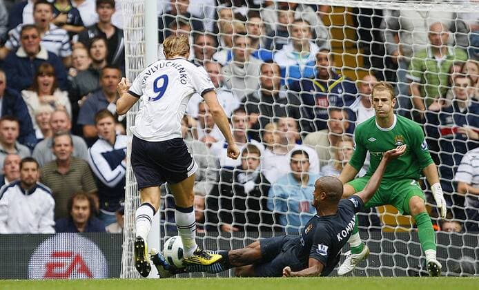 Vincent Kompany (C) of Manchester City blocks a shot from Roman Pavlyuchenko of Tottenham Hotspur Barclays Premier League Tottenham Hotspur v Manchester City 14th August, 2010 EDITORIAL USE ONLY. No use with unauthorised audio, video, data, fixture lists, club league logos or live services. Online in-match use limited to 120 images, no video emulation. No use in betting, games or single club league player publications.
