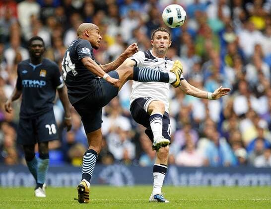 Nigel de Jong (L) of Manchester City and Robbie Keane of Tottenham Hotspur fight for the ball Barclays Premier League Tottenham Hotspur v Manchester City 14th August, 2010 EDITORIAL USE ONLY. No use with unauthorised audio, video, data, fixture lists, club league logos or live services. Online in-match use limited to 120 images, no video emulation. No use in betting, games or single club league player publications.