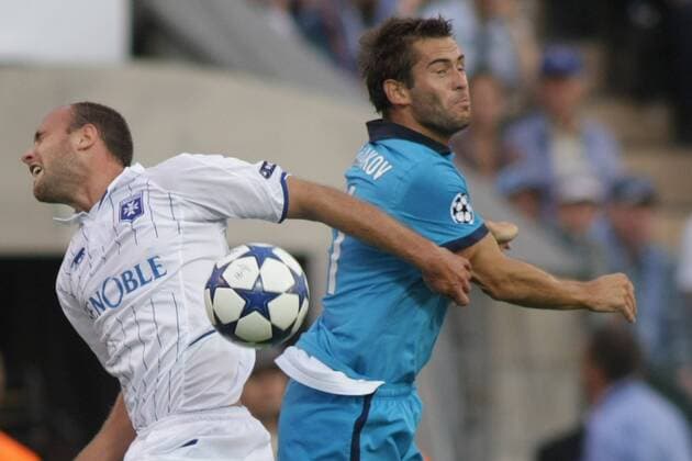 ST. PETERSBURG, RUSSIA. AUGUST 17, 2010. Jean-Pascal Mignot of AJ Auxerre (L) and Zenit s Alexander Kerzhakov in action during a UEFA Champions League Play-off game.  premiumd xint RE0D610E