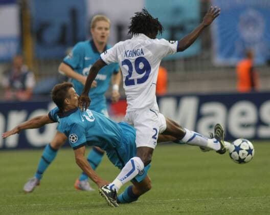 ST. PETERSBURG, RUSSIA. AUGUST 17, 2010. Zenit s Sergei Semak (bottom) and Delvin Ndinga of AJ Auxerre (R) fight for the ball during a UEFA Champions League Play-off game.  RE0D610D