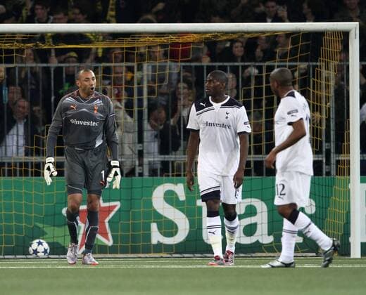 Tottenham s Heurelho Gomes (L) berates Sebastian Bassong after going 2-0 UEFA Champions League Qualifying Young Boys Bern (yellow) v Tottenham Hotspur (white) 17th August, 2010 EDITORIAL USE ONLY. No use with unauthorised audio, video, data, fixture lists, club league logos or live services. Online in-match use limited to 120 images, no video emulation. No use in betting, games or single club league player publications.