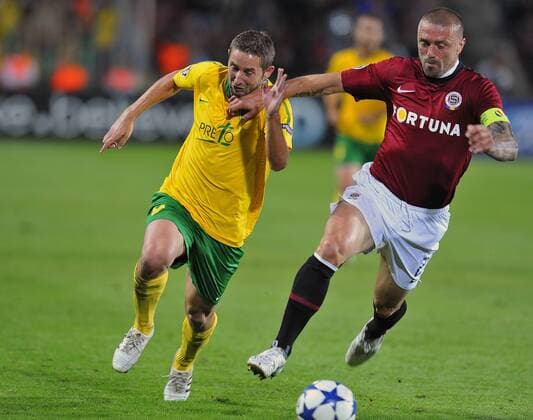 Tomas Repka, right, of Sparta Praha challenges Emil Rilke, left, of MSK Zilina in their Champions League qualifying play-off first leg match in Prague Tuesday, Aug. 17, 2010. (CTKxPhoto KaterinaxSulova)  CTKPhoto57201008170795701
