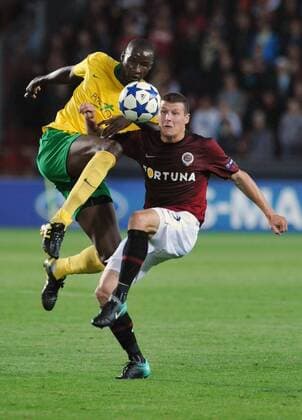 Momodou Ceesay, left, of MSK Zilina challenges Manuel Pamic, right, of Sparta Praha in their Champions League qualifying play-off first leg match in Prague Tuesday, Aug. 17, 2010. (CTKxPhoto RenexVolfik)  CTKPhoto57201008170799001