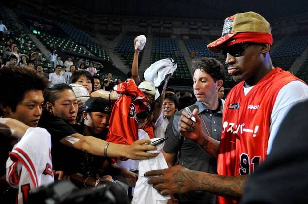Dennis Rodman signs autograph after the game of street basketball against Japan s Somecity goes to S2E at the Ariake Colosseum in Tokyo, Japan, on August 19, 2010.  TKP2010081933